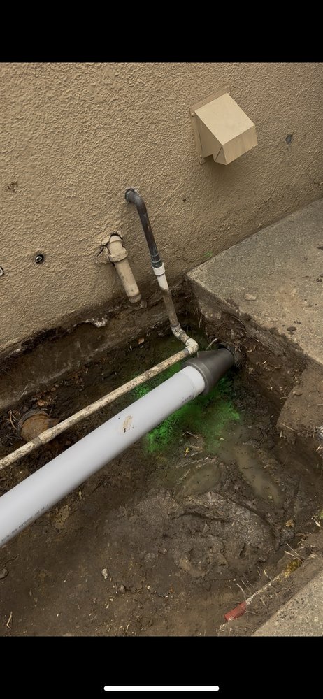 Exterior PVC drain line installation