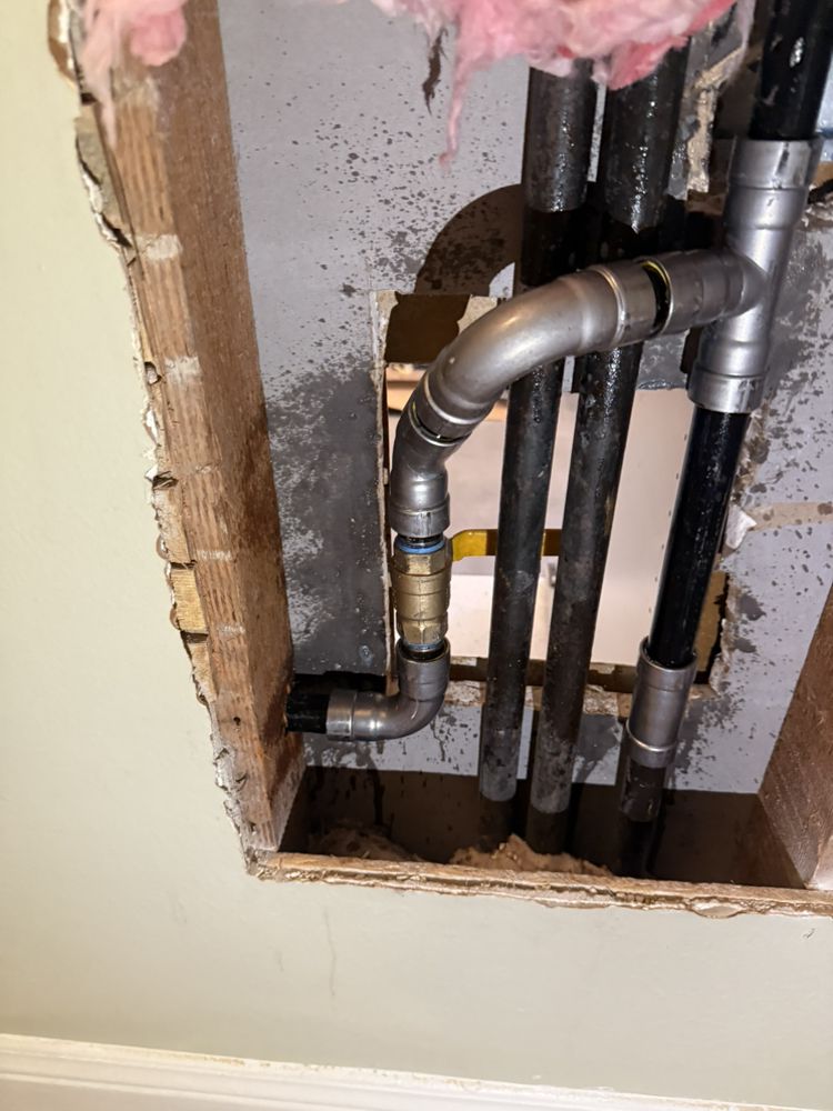 Whole-house repiping with new water lines run through wall framing